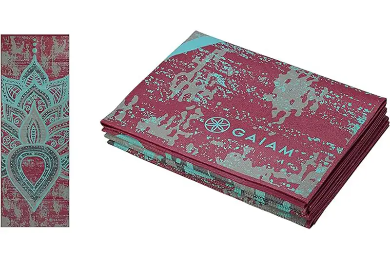 Two views of the Gaiam Foldable Yoga Travel Mat in a maroon and teal design