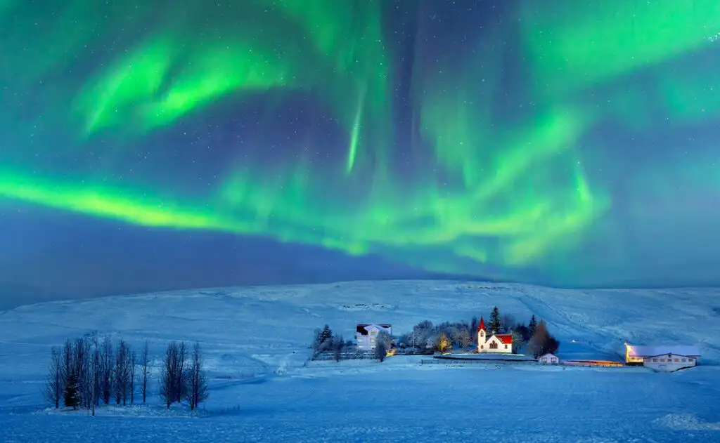 South Iceland Broad-Church at dusk near Hvolsvollur, Iceland, under a spectacular Northern Lights display