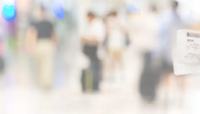 Closeup of girl holding passports and boarding pass at airport , panorama