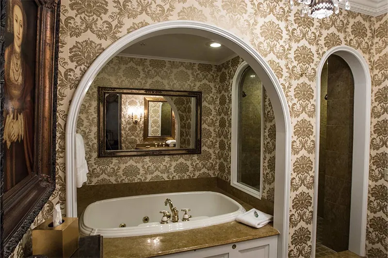 Bathtub in a gold-embellished bathroom at The Chanler at Cliff Walk, Rhode Island