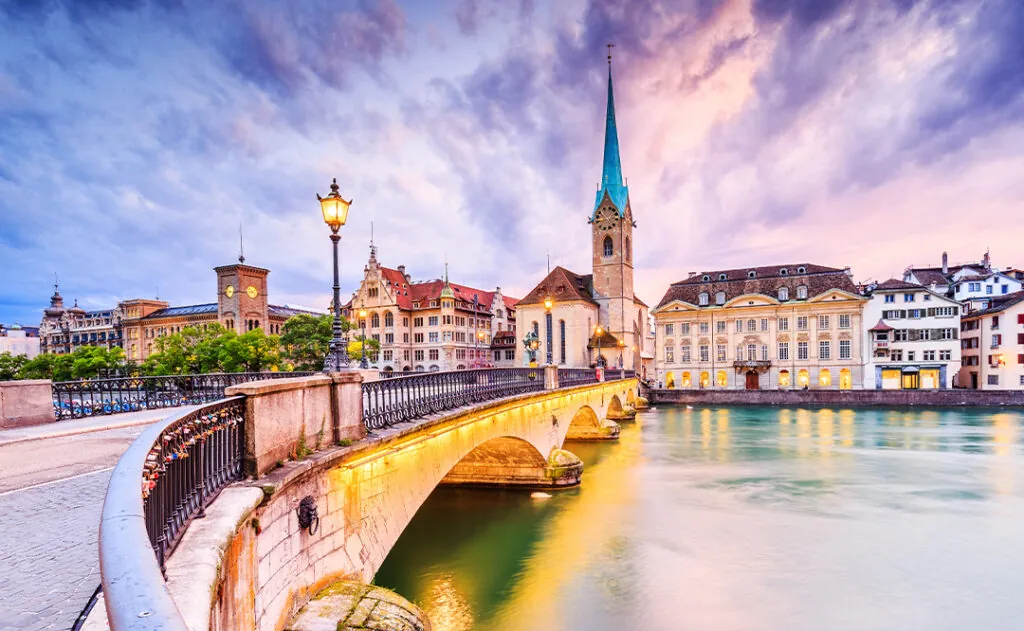 Zurich, Switzerland. View of the historic city center with famous Fraumunster Church, on the Limmat river.
