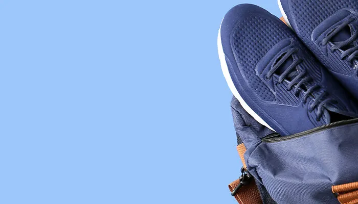 Sports bag on blue background with space for text
