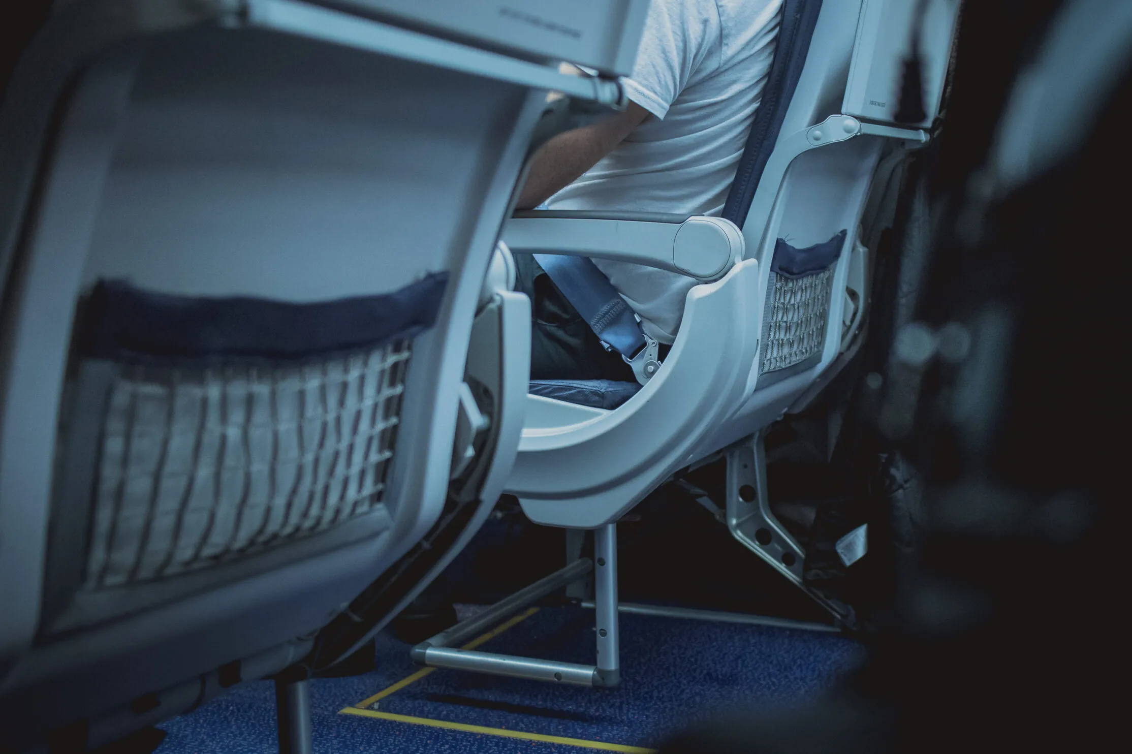 Mesh seatback pockets on airplane seats