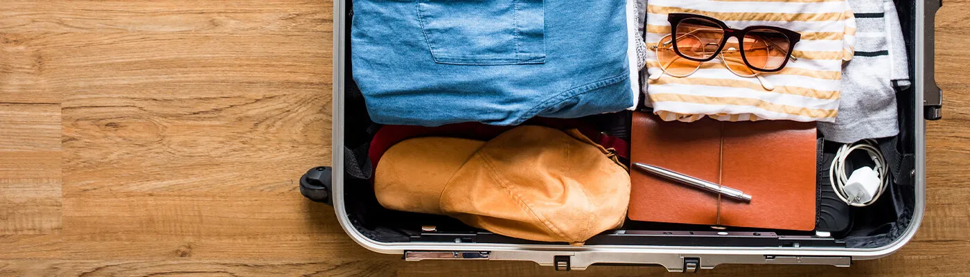 Packed suitcase on a hard wood floor